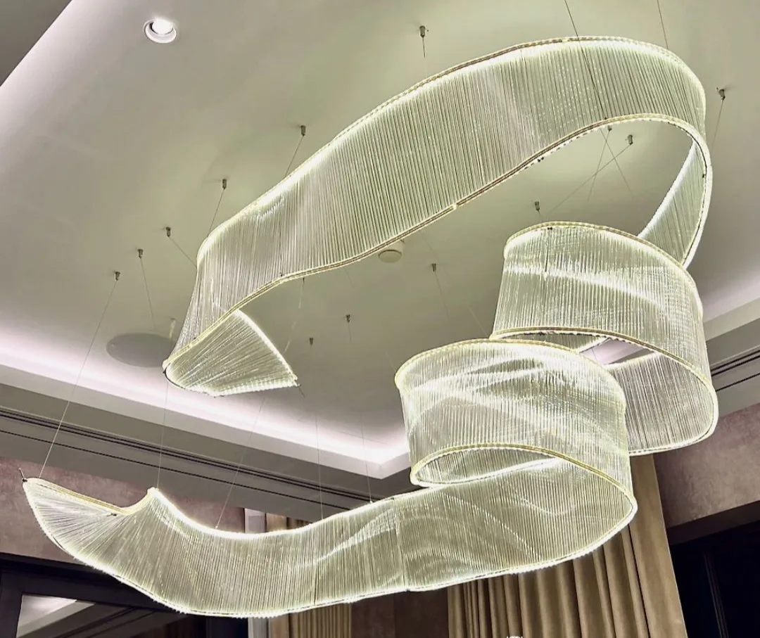 An illuminated ribbon light feature set into a wall niche