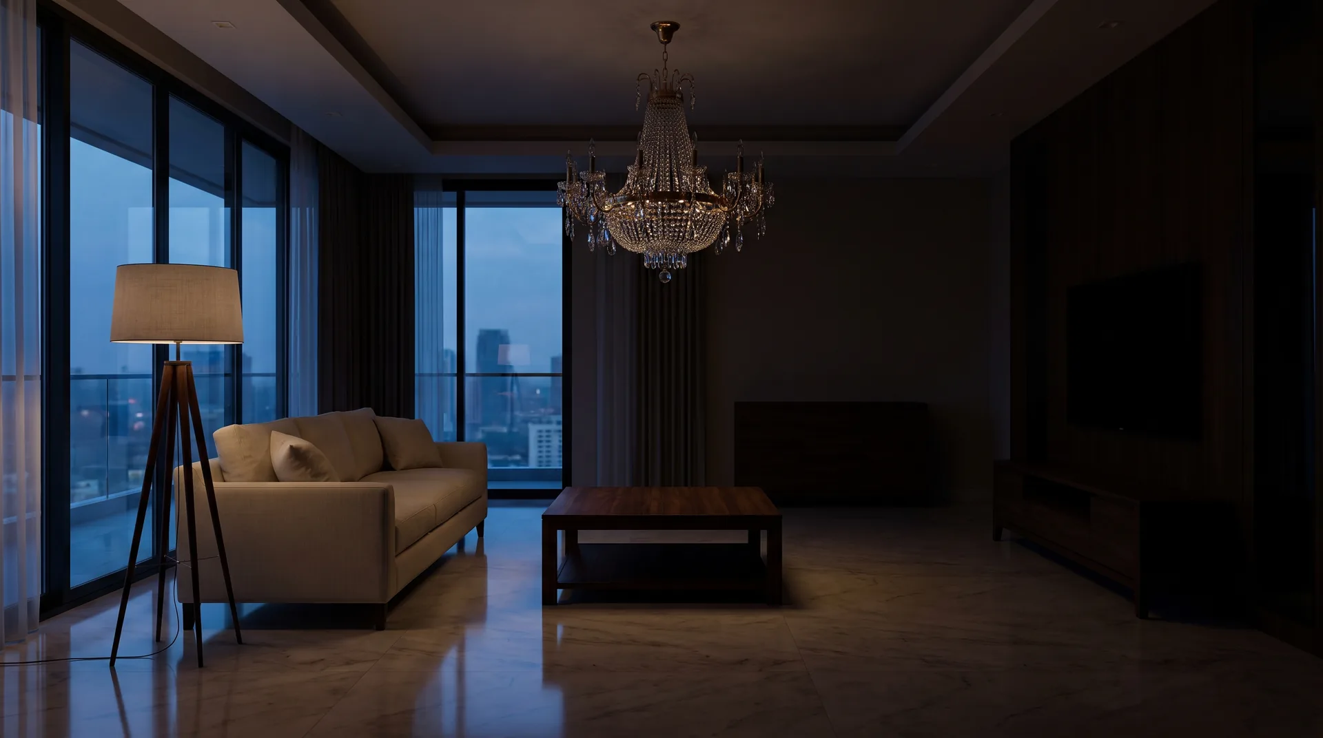 A dim penthouse living room at dusk with an unlit crystal chandelier