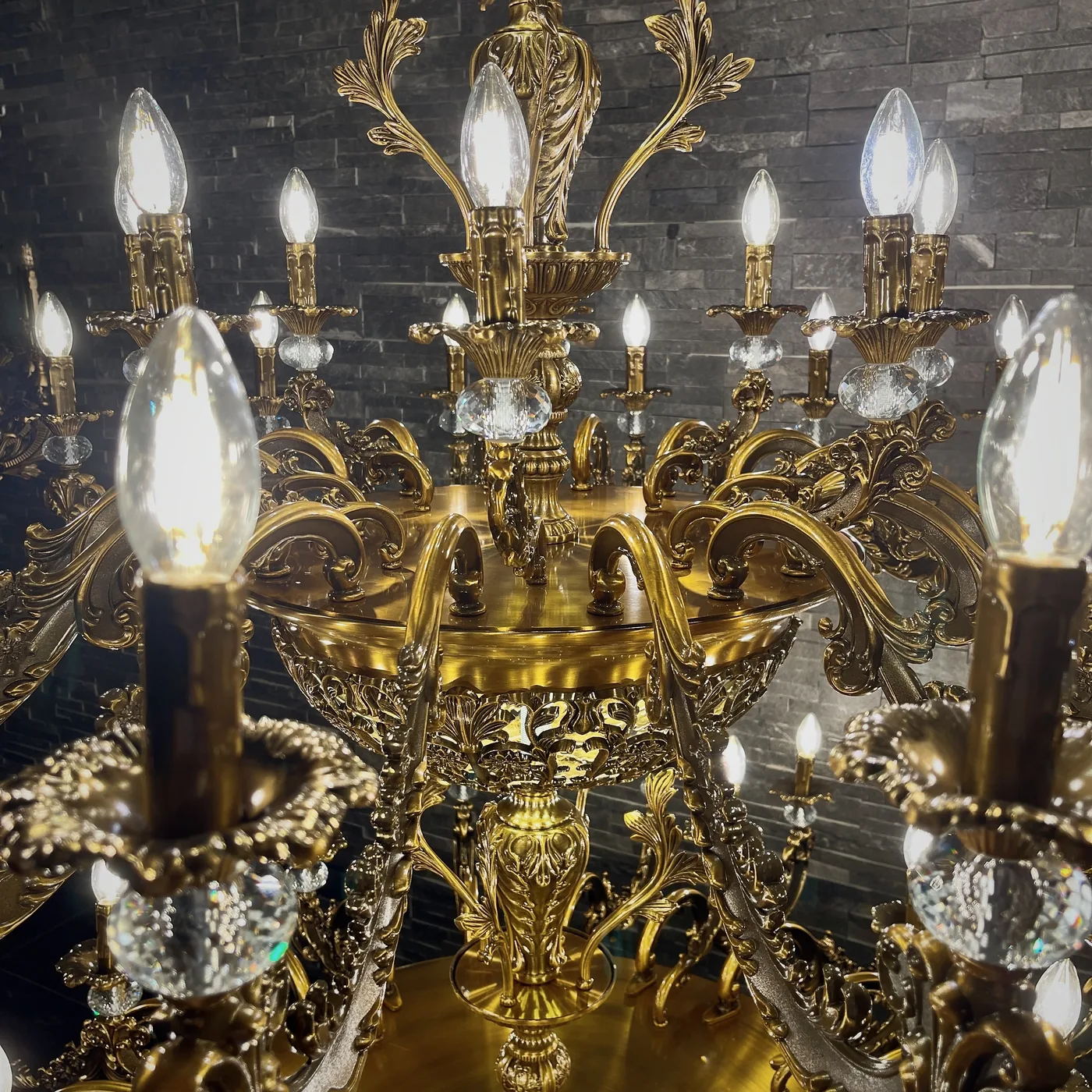 Close detail of a gilt brass and crystal chandelier, custom made by Leo Light